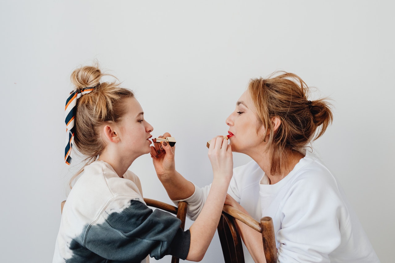 Two women's doing their makeups